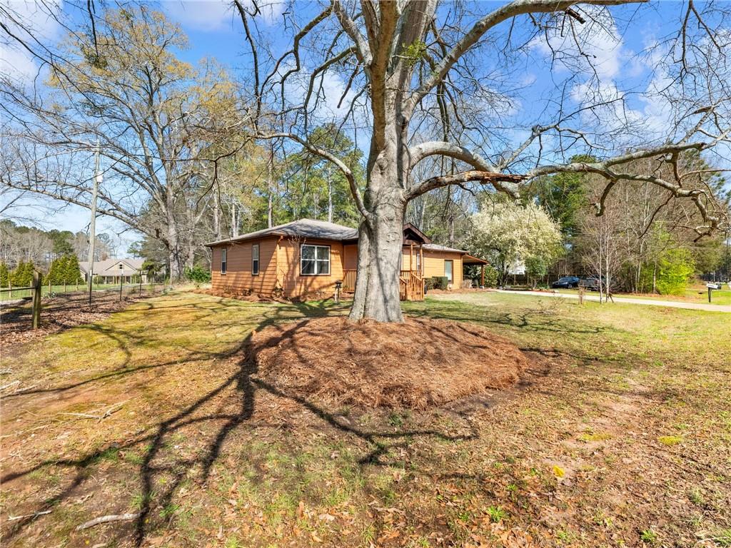 1686 Shoal Creek Road Monroe, GA 30656 - Photo 31 of 50 a view of yard with tree in front of it