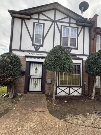 a front view of a house with a garage