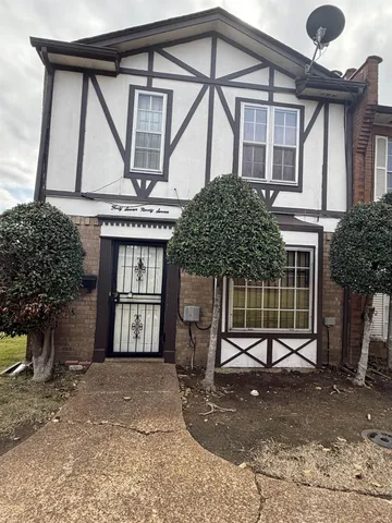 a front view of a house with a garage