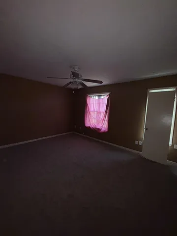 a view of an empty room and window