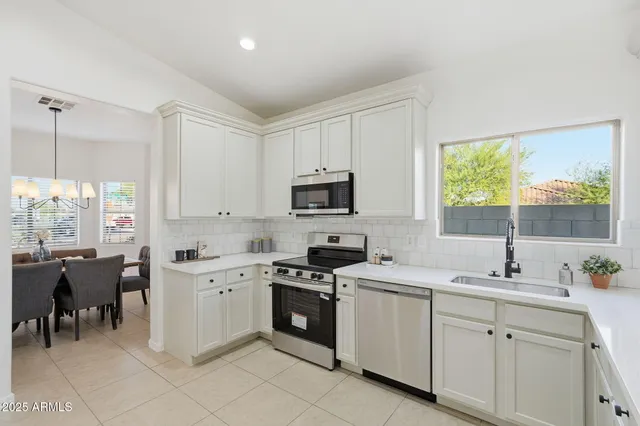 a room with a sink and a mirror