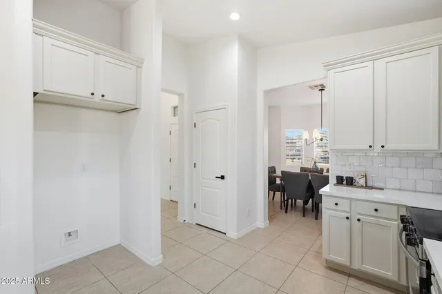 a view of a dining room with furniture and windows