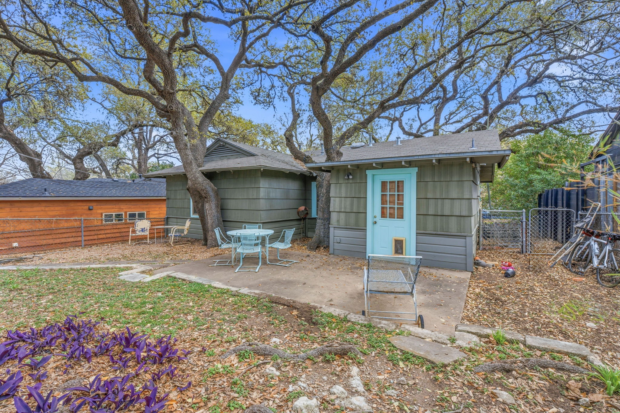 1112 Mission Ridge Austin, TX 78704 - Photo 13 of 22 a view of a chair and table in backyard of the house