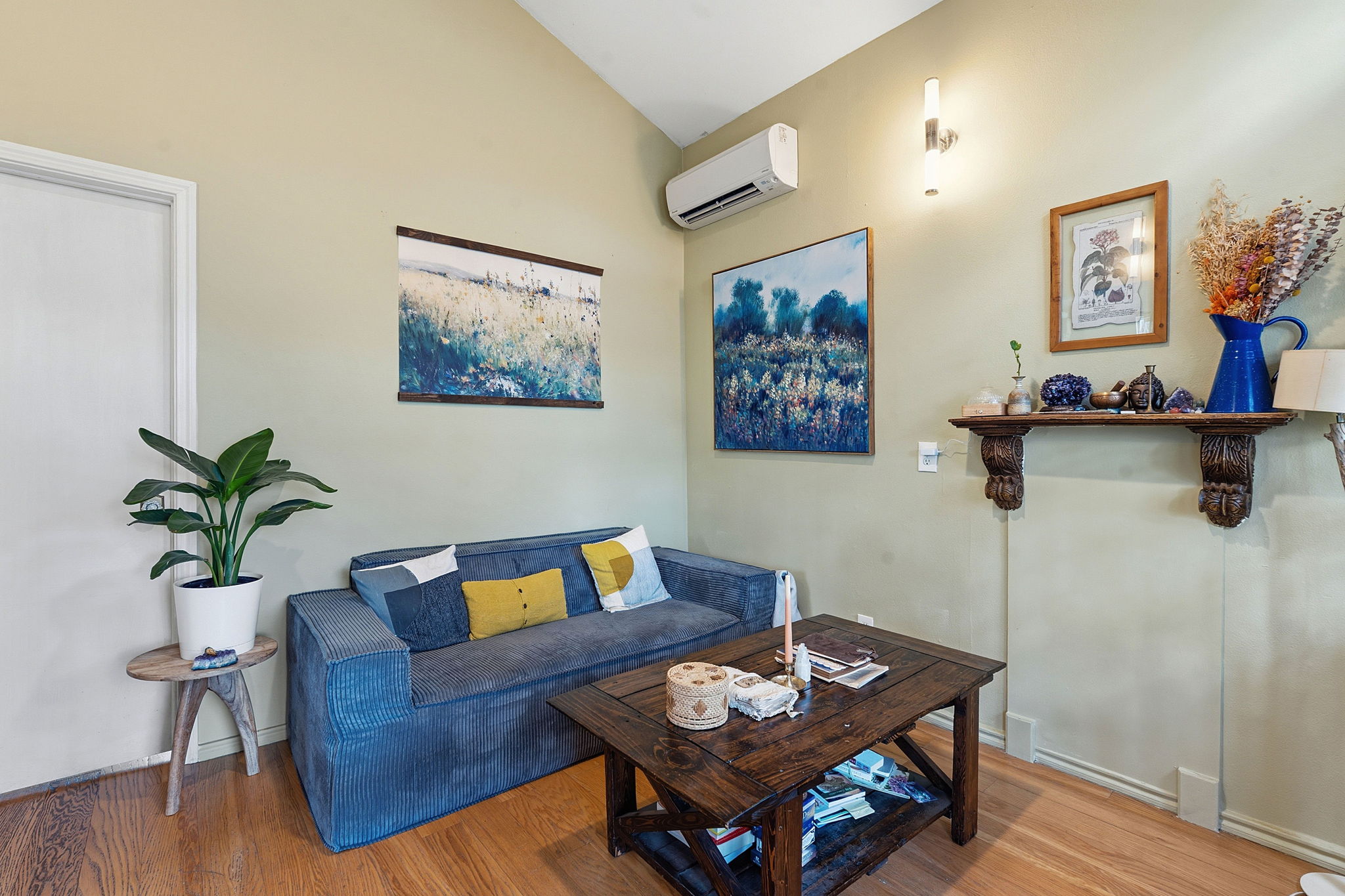 1112 Mission Ridge Austin, TX 78704 - Photo 22 of 22 a living room with furniture and wooden floor