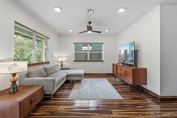 a living room with furniture and a flat screen tv