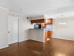 a kitchen with a refrigerator and microwave