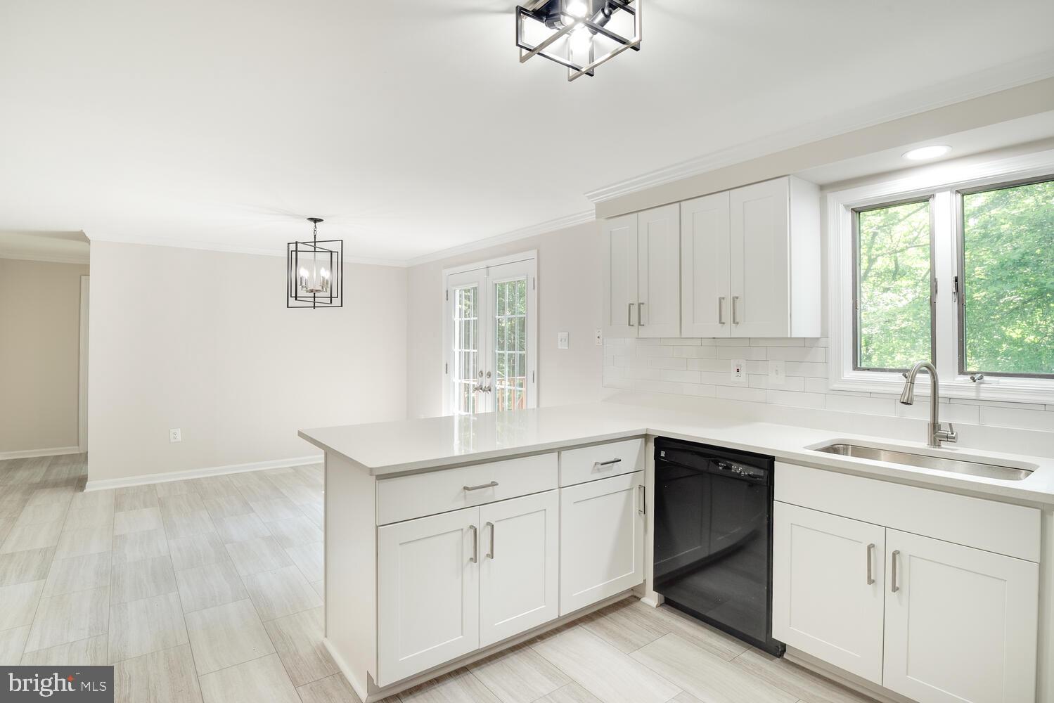 8115 Stacey Road Alexandria, VA 22308 - Photo 12 of 35 a kitchen with white cabinets and sink