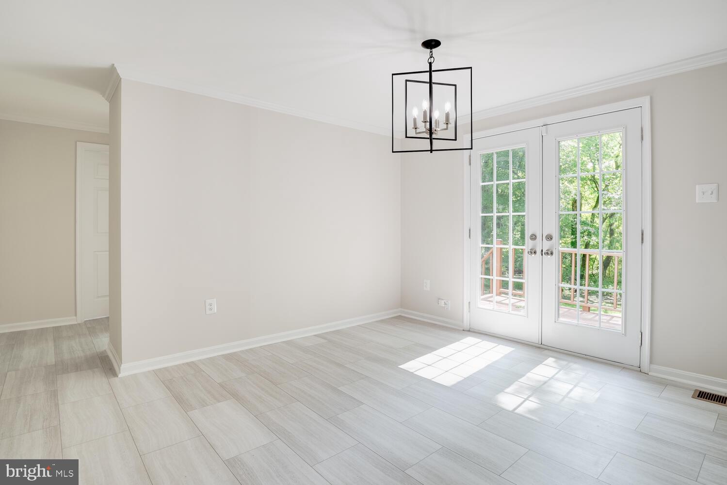 8115 Stacey Road Alexandria, VA 22308 - Photo 13 of 35 an empty room with wooden floor and windows