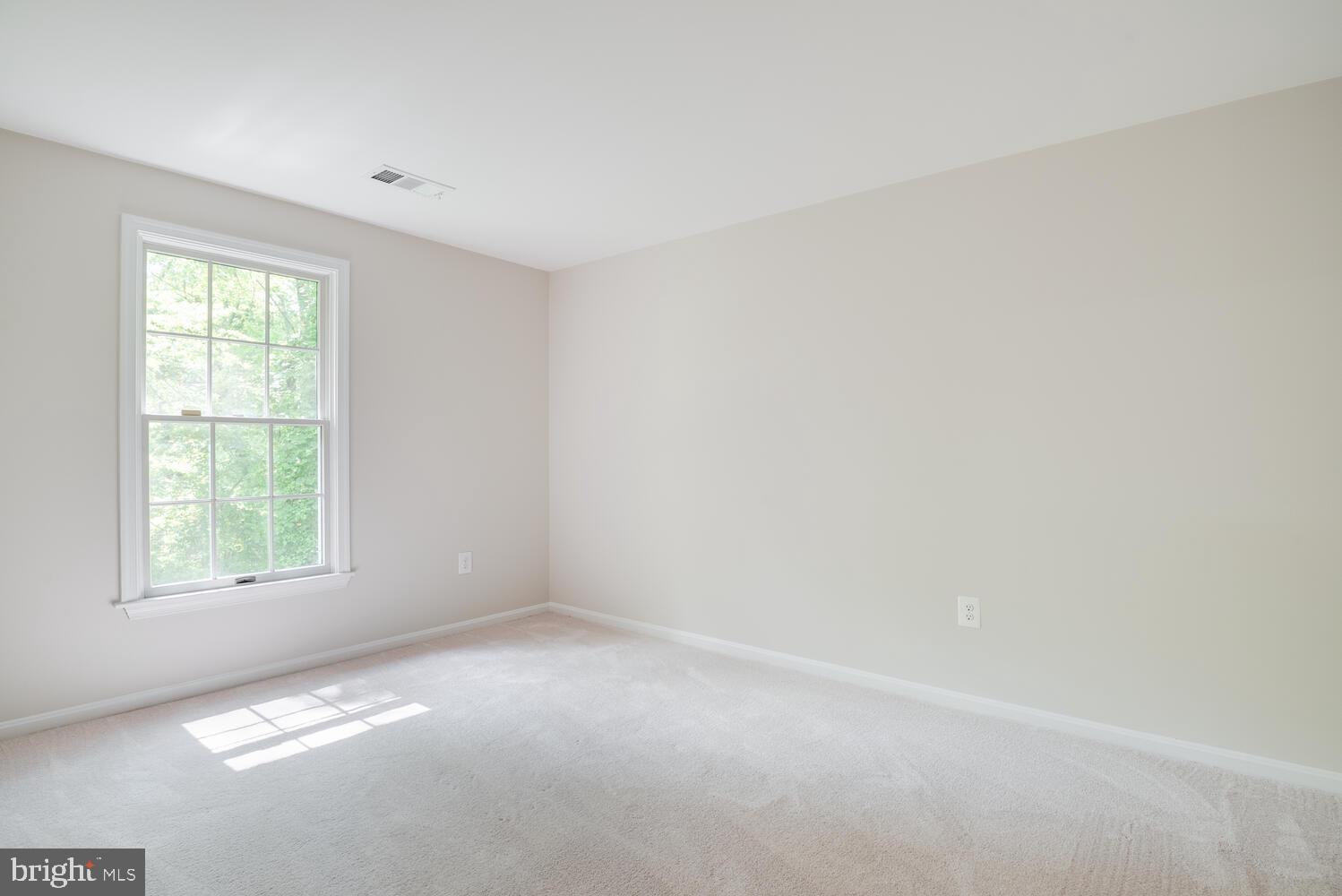 8115 Stacey Road Alexandria, VA 22308 - Photo 19 of 35 an empty room with windows