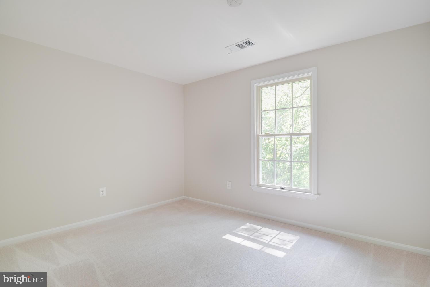 8115 Stacey Road Alexandria, VA 22308 - Photo 21 of 35 an empty room with windows