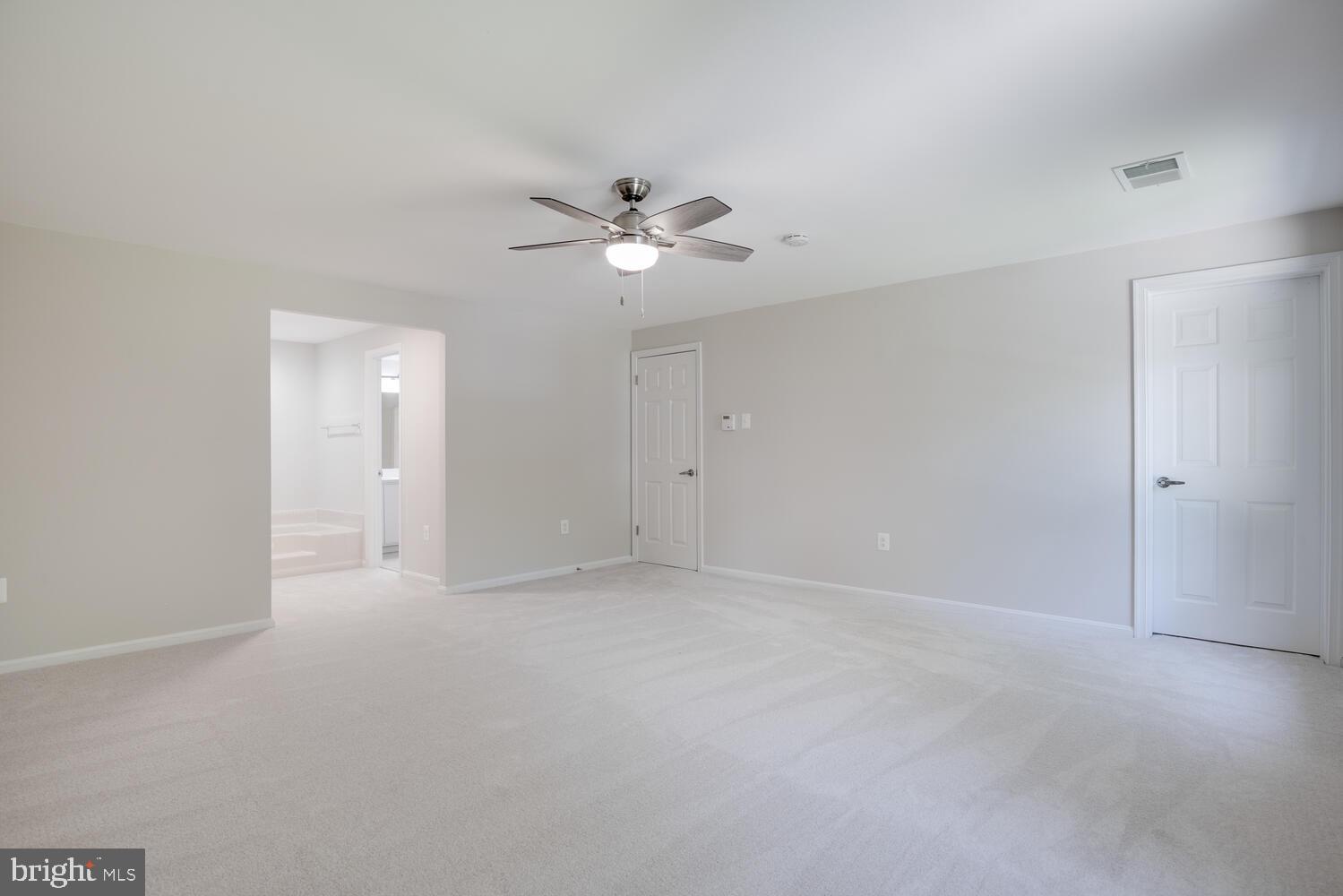 8115 Stacey Road Alexandria, VA 22308 - Photo 25 of 35 a view of an empty room with a ceiling fan