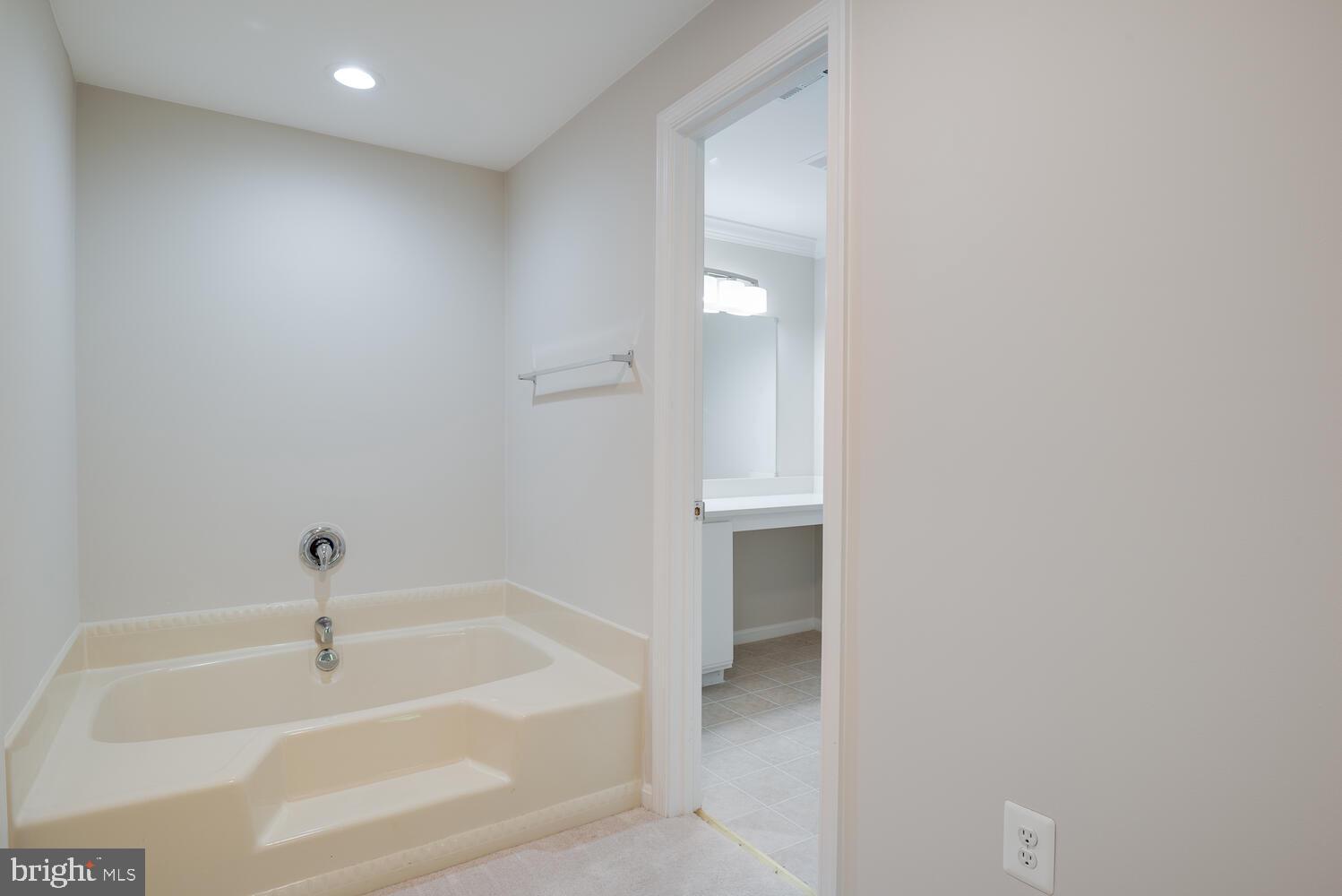 8115 Stacey Road Alexandria, VA 22308 - Photo 26 of 35 a bathroom with a bathtub