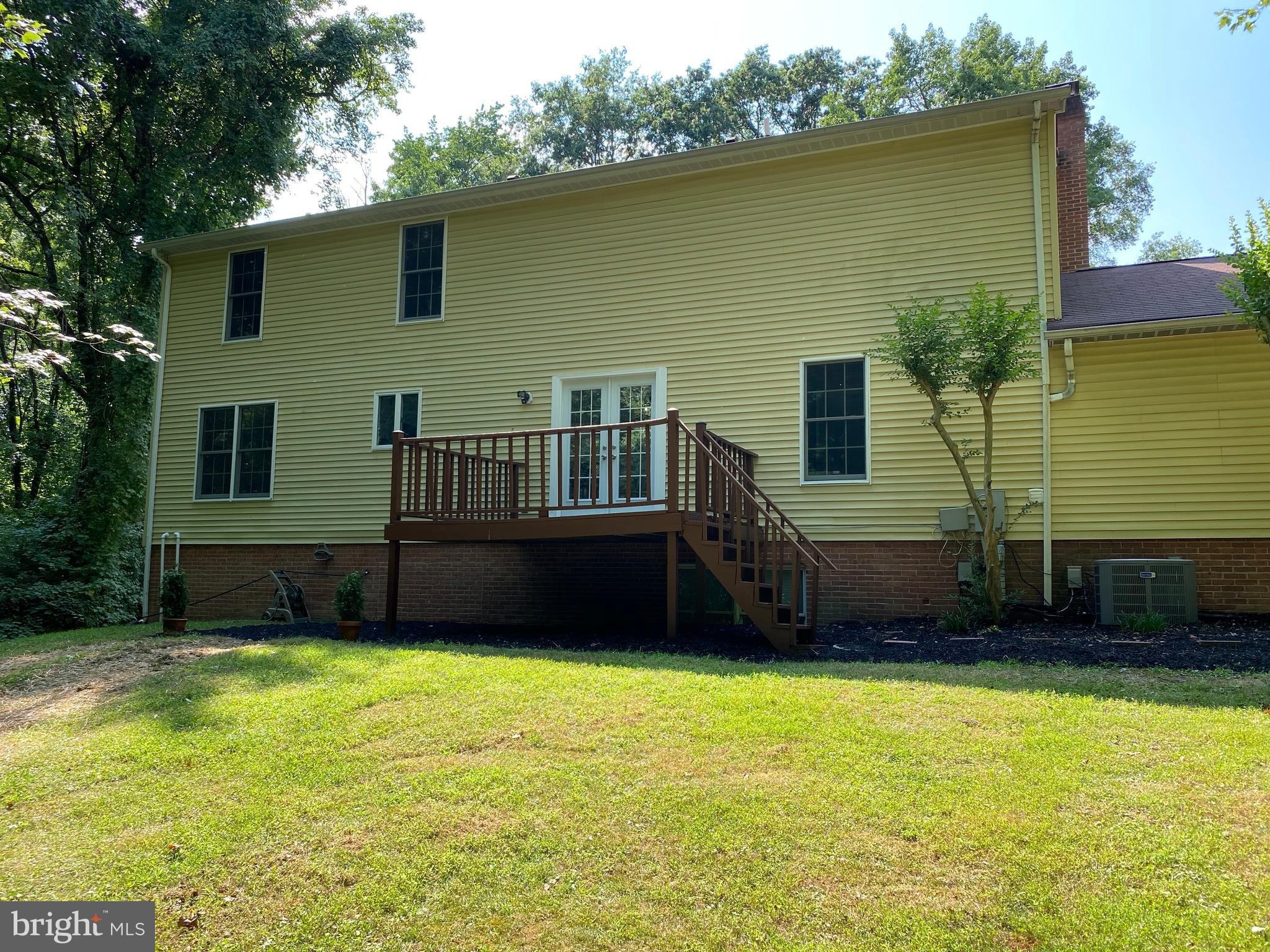 8115 Stacey Road Alexandria, VA 22308 - Photo 32 of 35 a front view of a house with a yard