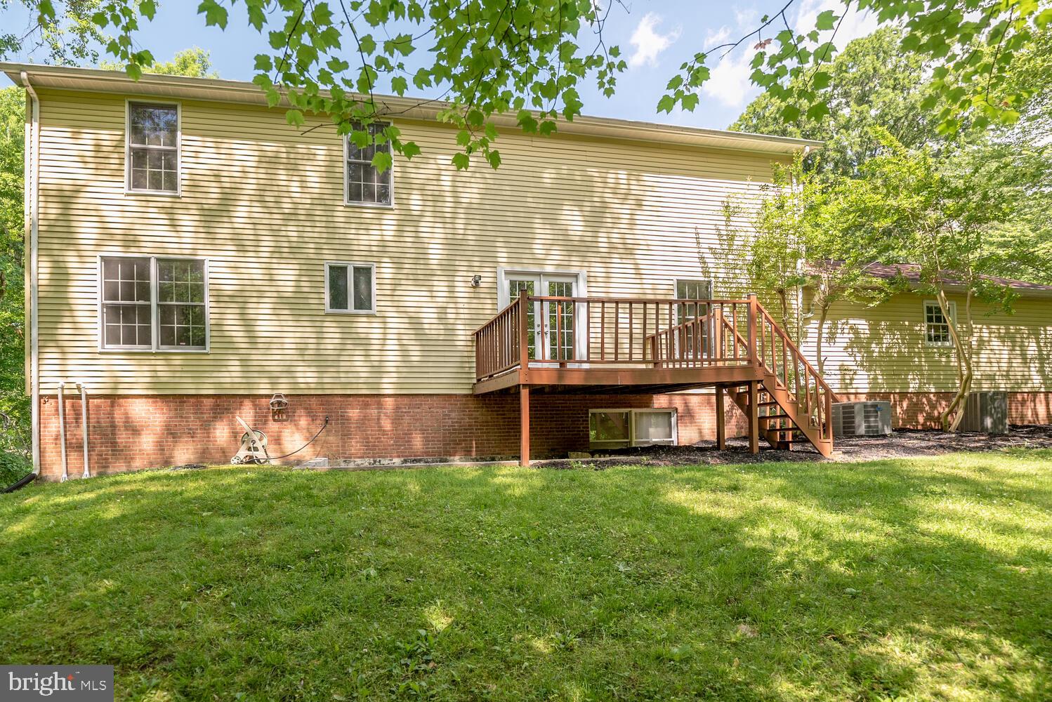 8115 Stacey Road Alexandria, VA 22308 - Photo 33 of 35 a view of a house with a backyard