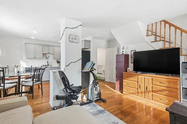 a view of a livingroom with furniture and a flat screen tv