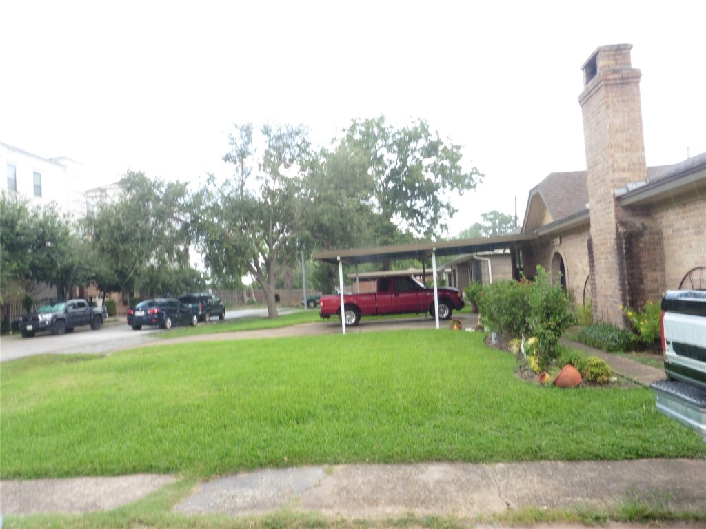 2402 Reinerman Street Houston, TX 77007 - Photo 3 of 6 a view of a house with a backyard porch and sitting area