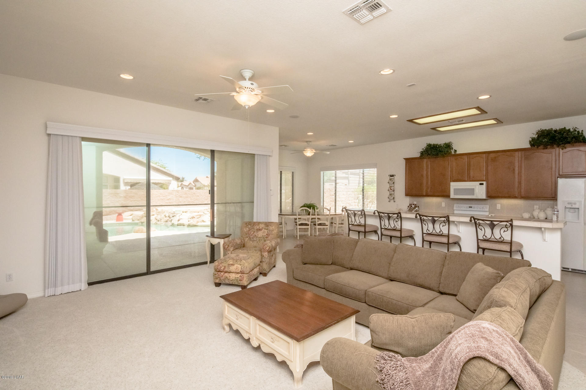 3889 Nottinghill Road Lake Havasu City, AZ 86404 - Photo 17 of 75 Living Room has big windows. Bright and Cheery.
