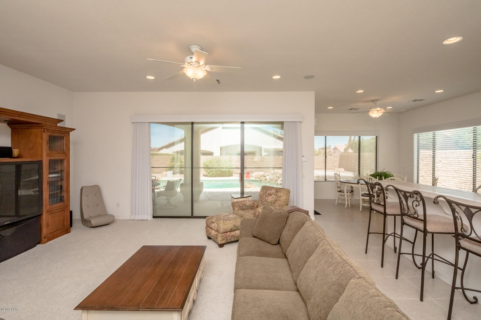 3889 Nottinghill Road Lake Havasu City, AZ 86404 - Photo 18 of 75 The pool right outside if the living room. Water view all day.