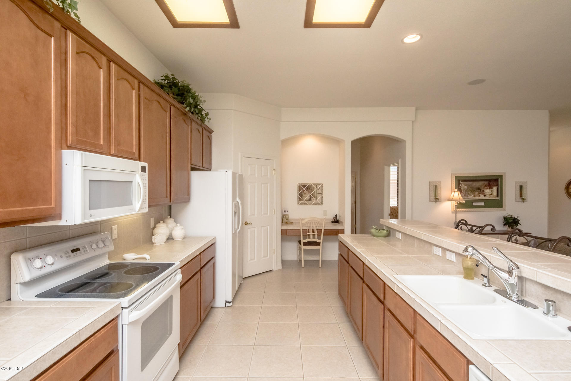 3889 Nottinghill Road Lake Havasu City, AZ 86404 - Photo 27 of 75 Desk area at the end of kitchen by pantry.