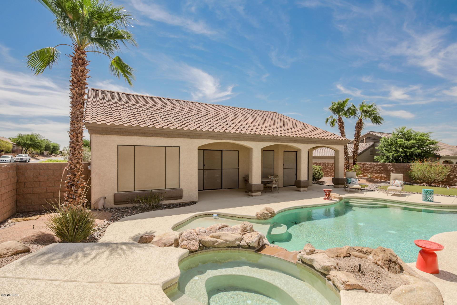 3889 Nottinghill Road Lake Havasu City, AZ 86404 - Photo 3 of 75 Backyard paradise. Covered patio. Pool, Spa, Sitting bench, Beach Entry, Umbrella Table.