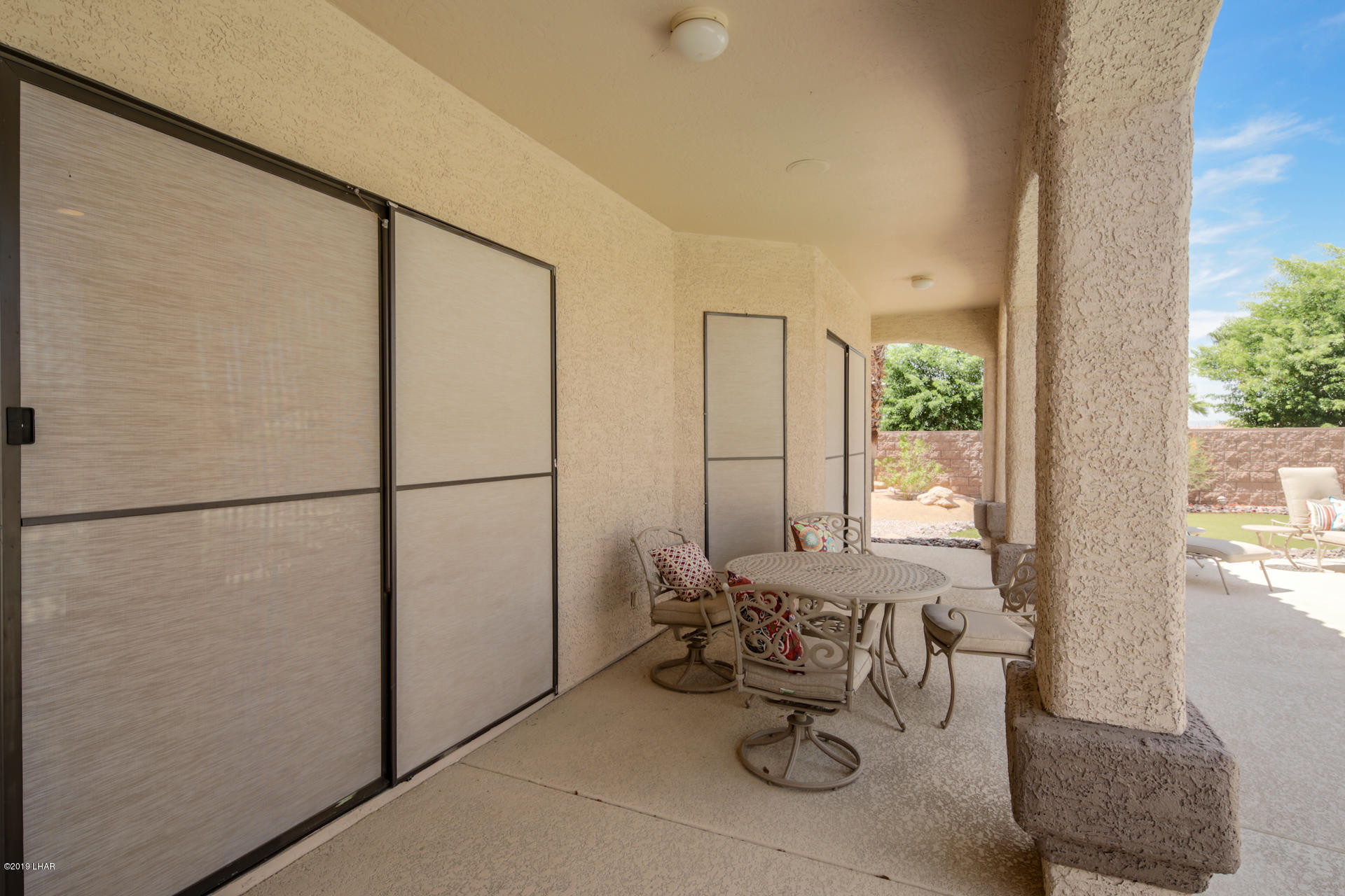 3889 Nottinghill Road Lake Havasu City, AZ 86404 - Photo 48 of 75 Back covered patio. Sun screens on windows.