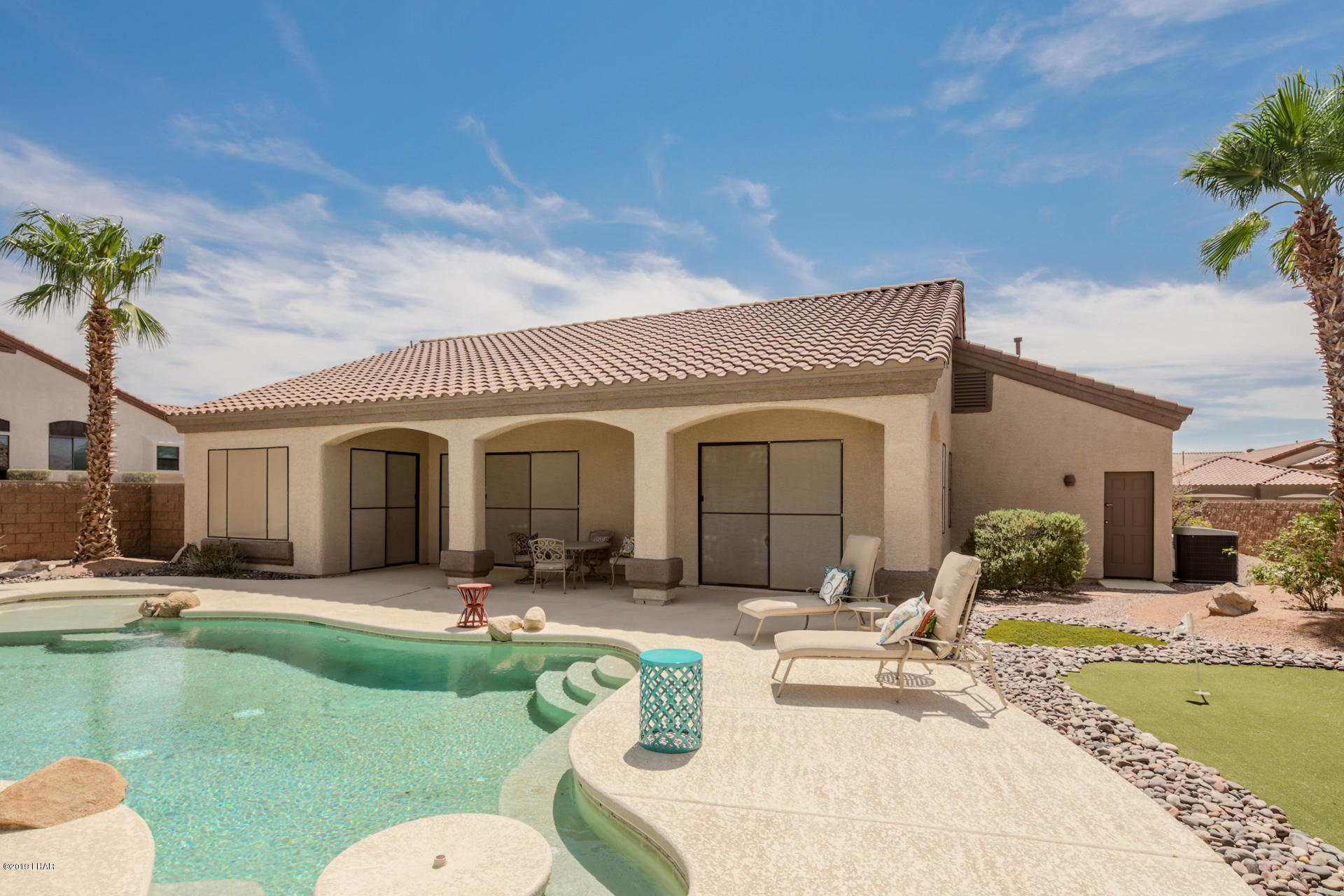 3889 Nottinghill Road Lake Havasu City, AZ 86404 - Photo 6 of 75 Umbrella Table. Bench built in around this end of pool.