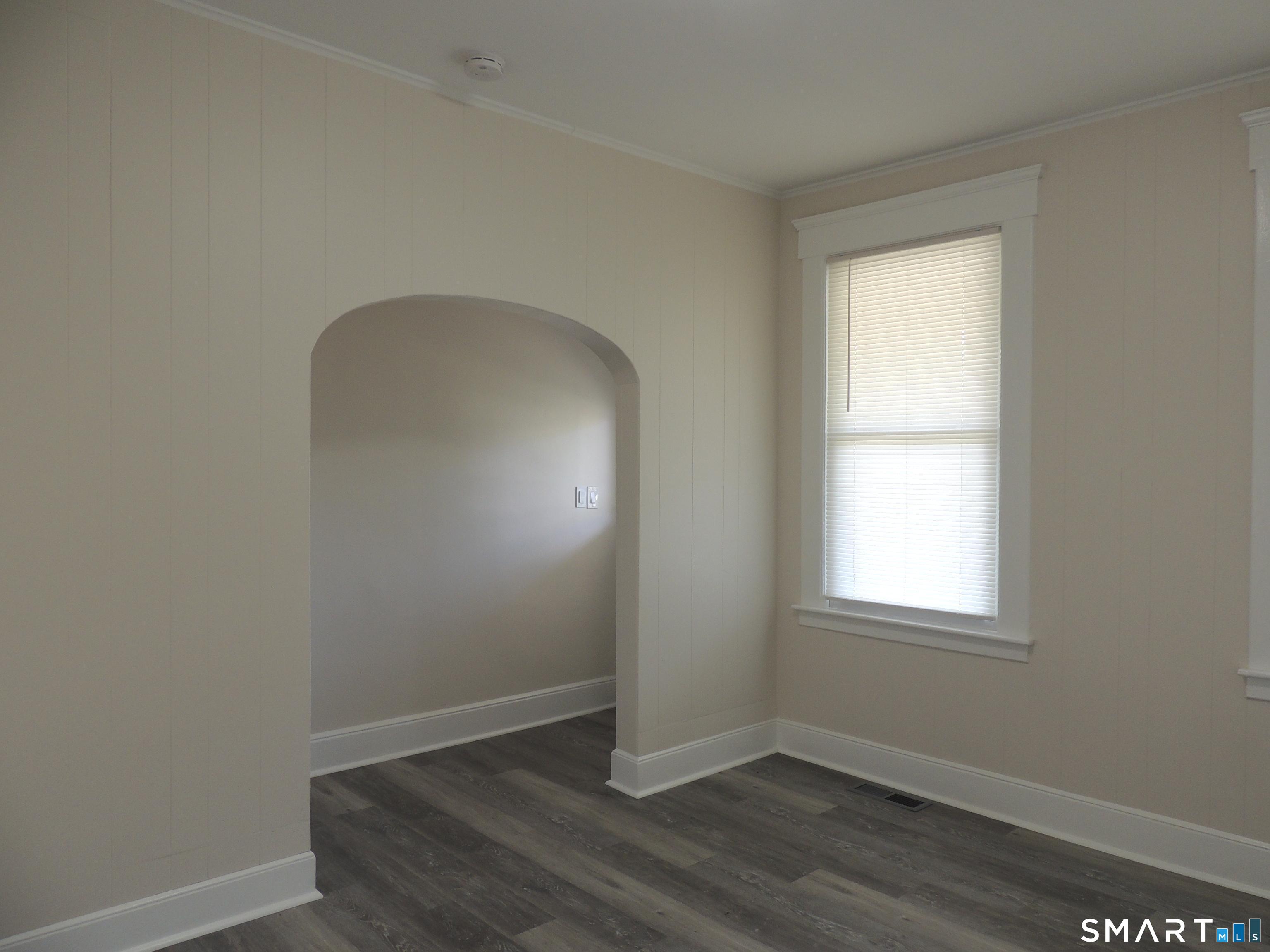 132 Silver Sands Road, Unit 1 East Haven, CT 06512 - Photo 4 of 20 Front hall has closet, archway to LR