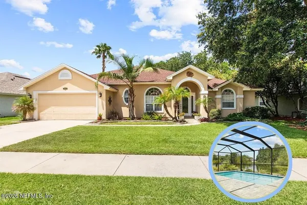 a front view of a house with a garden and plants
