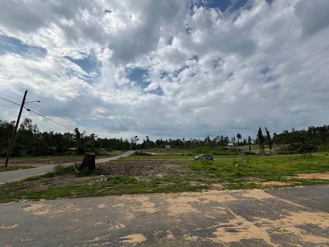 a view of a lake with a big yard