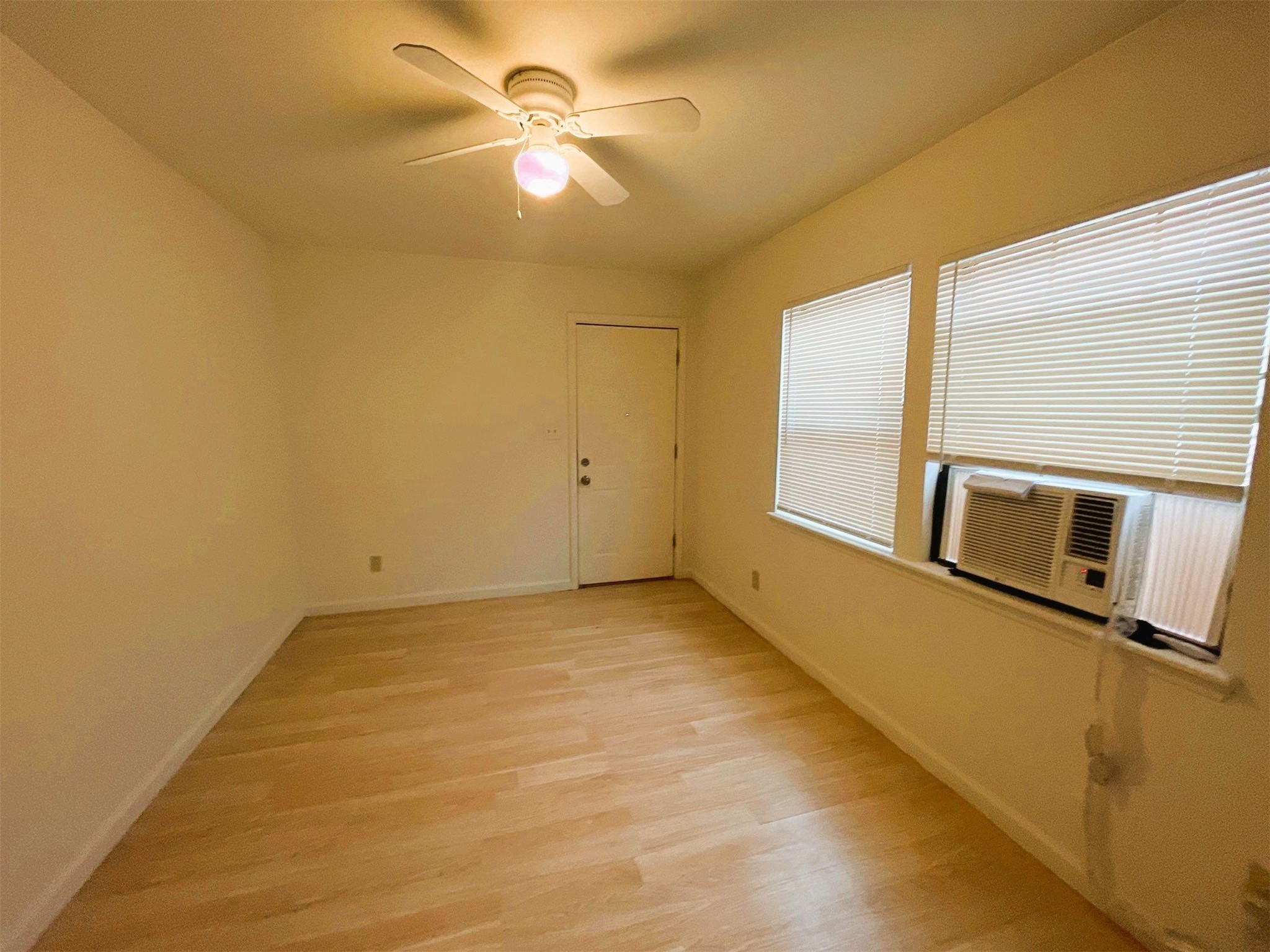 3815 Drew Street Houston, TX 77004 - Photo 7 of 11 a view of a livingroom with an empty space & a ceiling fan