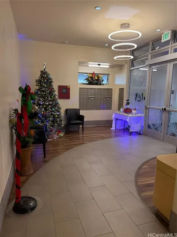 a room with lots of furniture and a chandelier