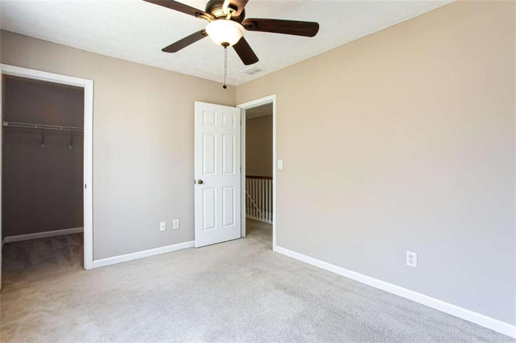 3721 Bogan Mill Road Northeast Buford, GA 30519 - Photo 36 of 58 an empty room and a fan fan