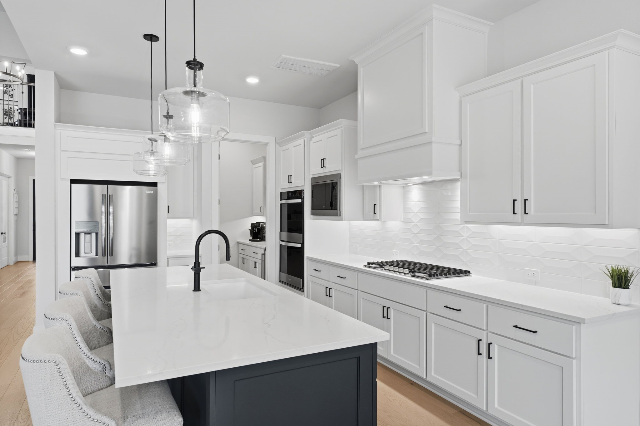 4708 Lorelai Lane Spring, TX 77386 - Photo 13 of 50 a kitchen with stainless steel appliances a refrigerator sink and cabinets