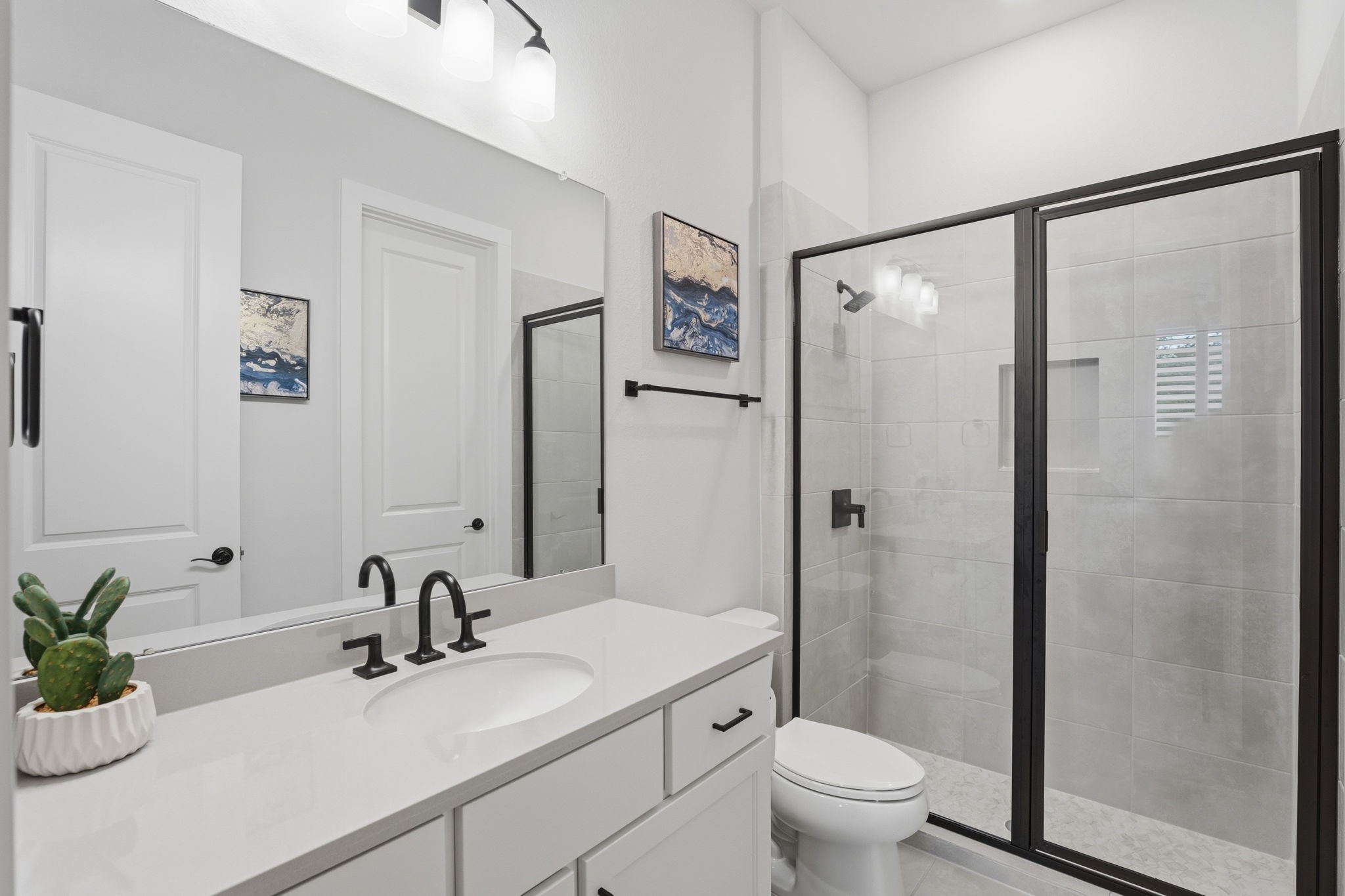 4708 Lorelai Lane Spring, TX 77386 - Photo 27 of 50 a bathroom with a granite countertop sink toilet and shower