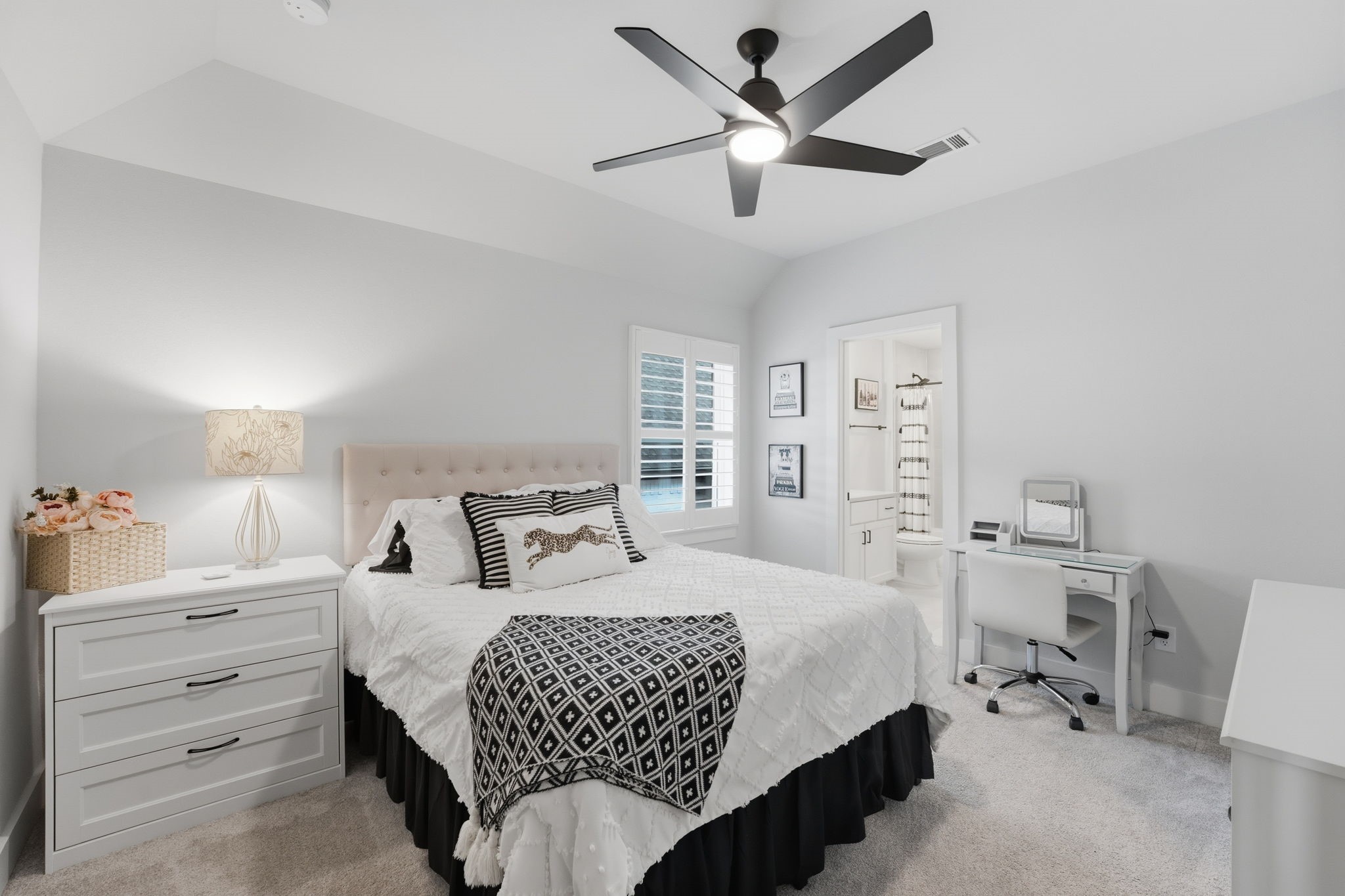4708 Lorelai Lane Spring, TX 77386 - Photo 35 of 50 a bedroom with a bed and a chandelier