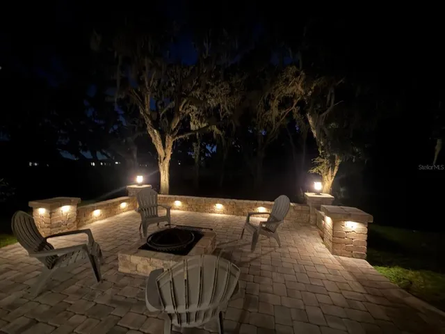 a kitchen with lots of lights and green space