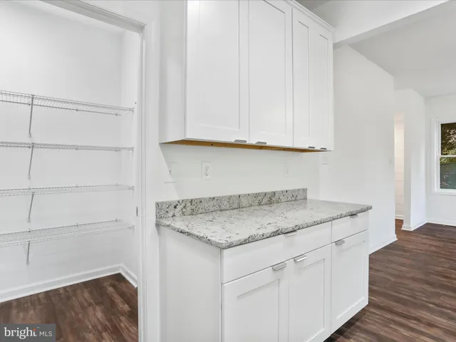 a view white cabinets and granite counter tops