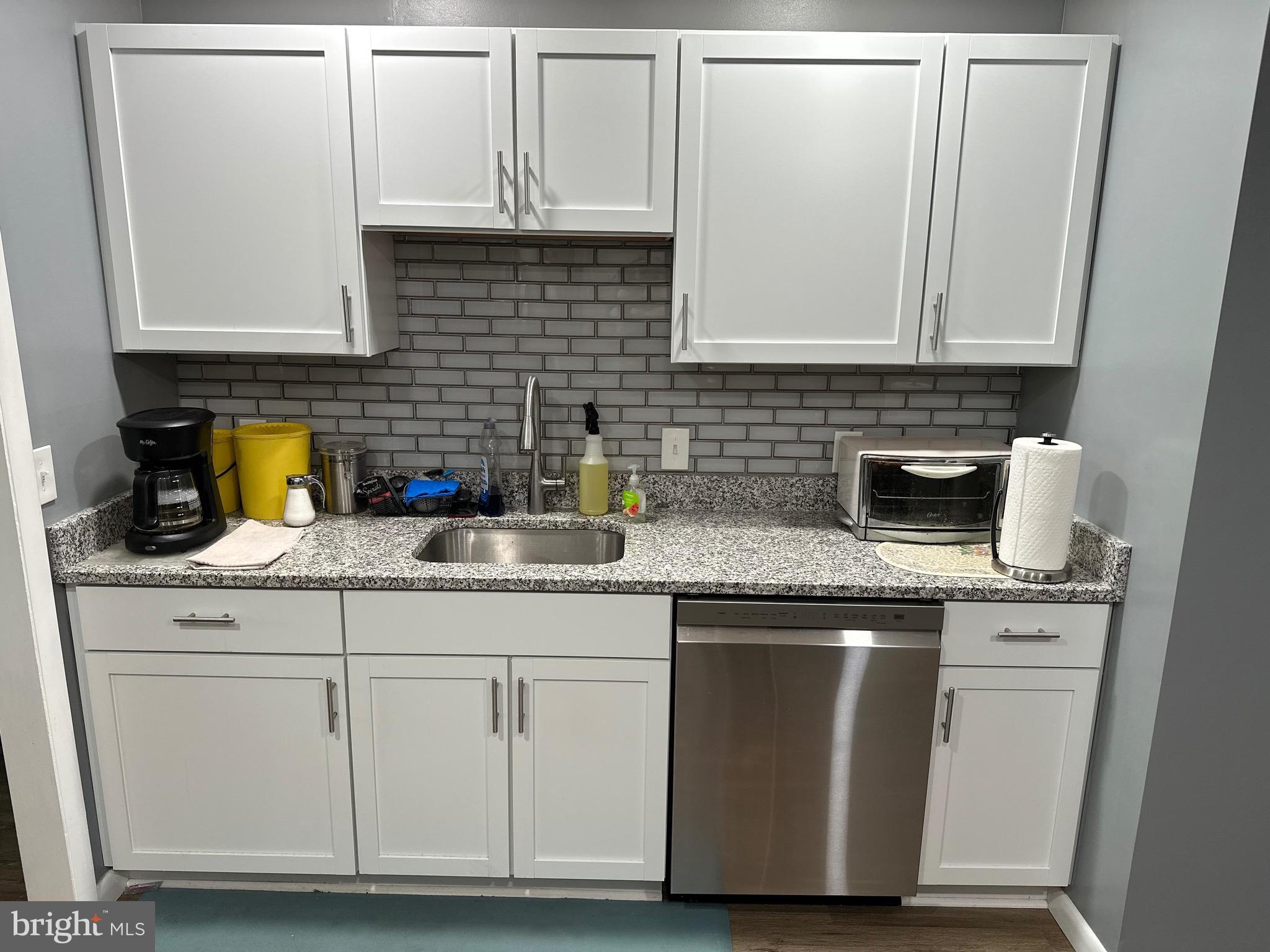 156 South Ritters Lane Owings Mills, MD 21117 - Photo 11 of 42 a kitchen with granite countertop a sink and cabinets
