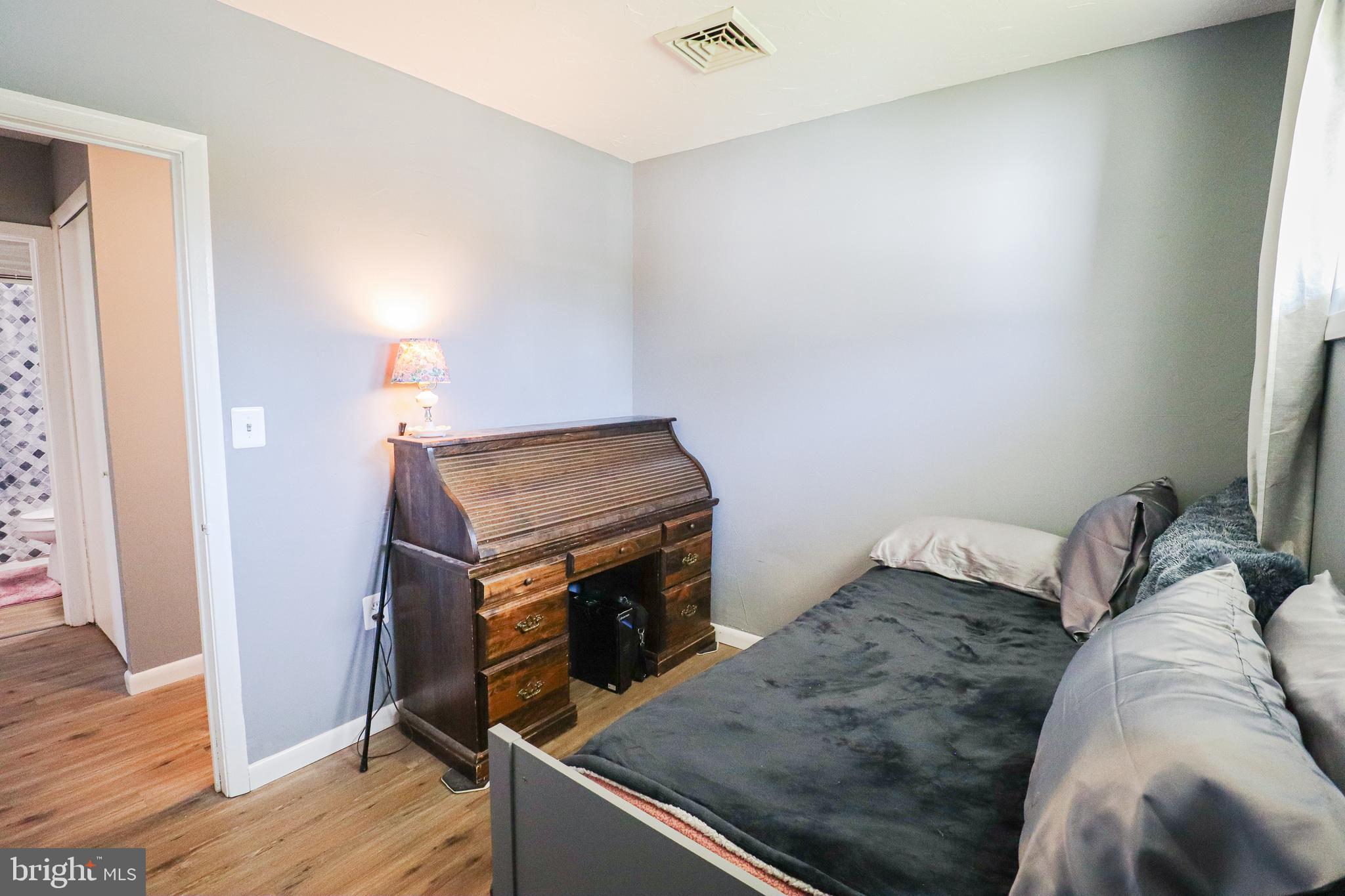 156 South Ritters Lane Owings Mills, MD 21117 - Photo 22 of 42 a bed sitting in a bedroom next to a window