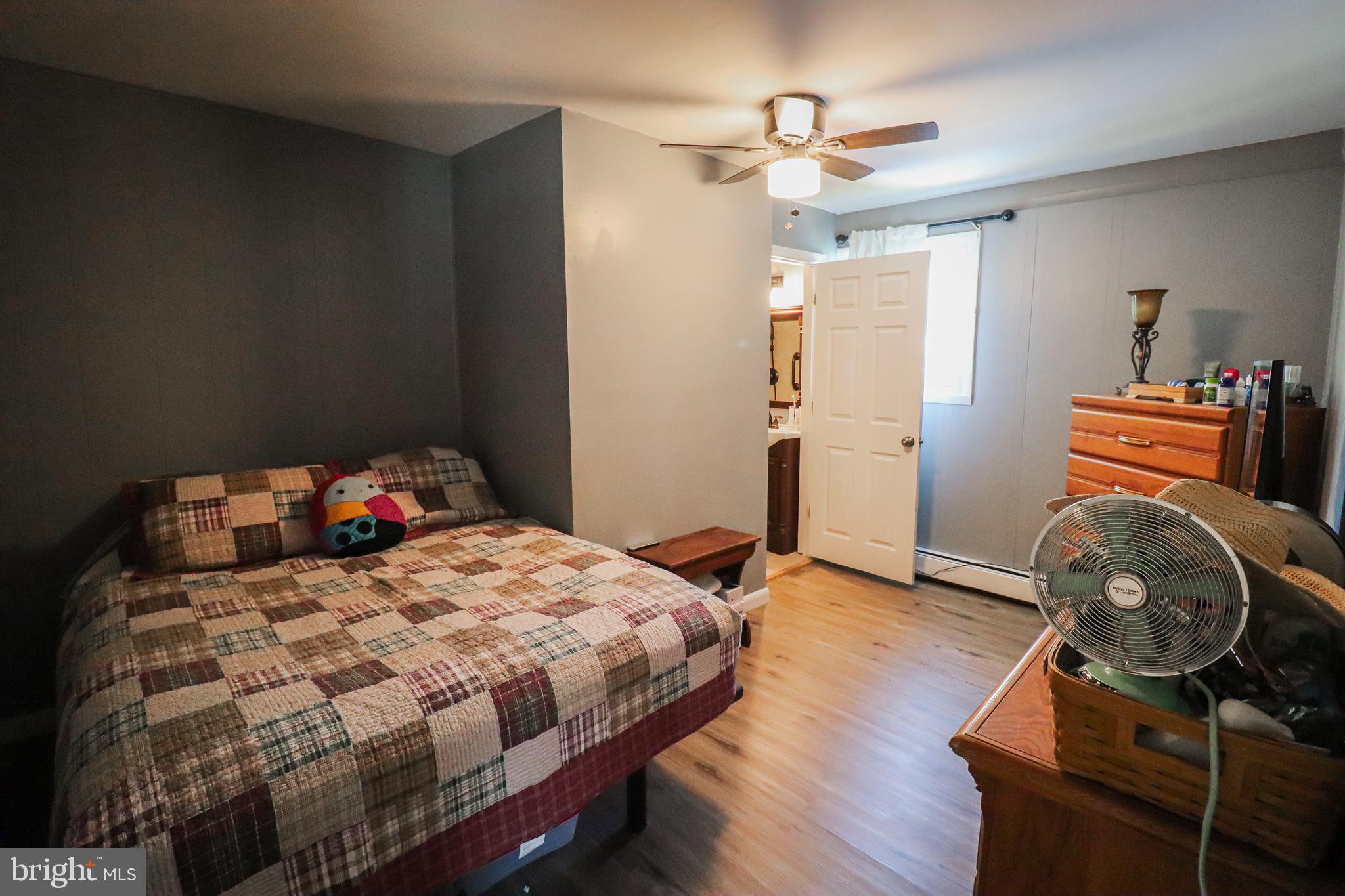 156 South Ritters Lane Owings Mills, MD 21117 - Photo 25 of 42 a bedroom with a bed and a chair in it