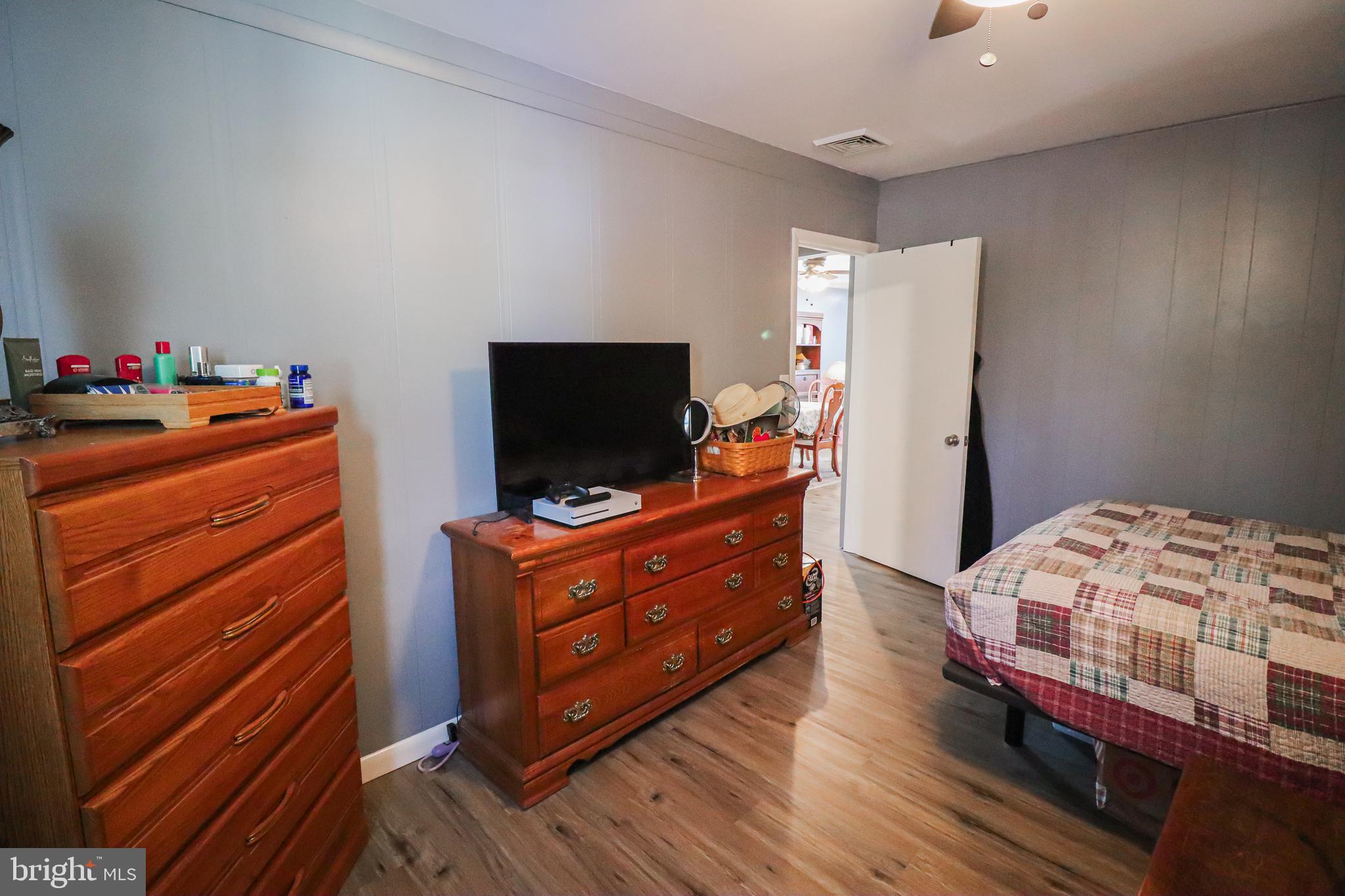 156 South Ritters Lane Owings Mills, MD 21117 - Photo 27 of 42 a room with furniture and flat screen tv