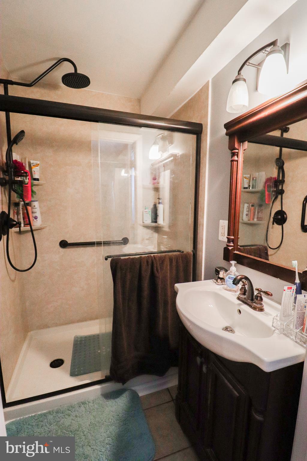 156 South Ritters Lane Owings Mills, MD 21117 - Photo 28 of 42 a bathroom with a sink and a mirror