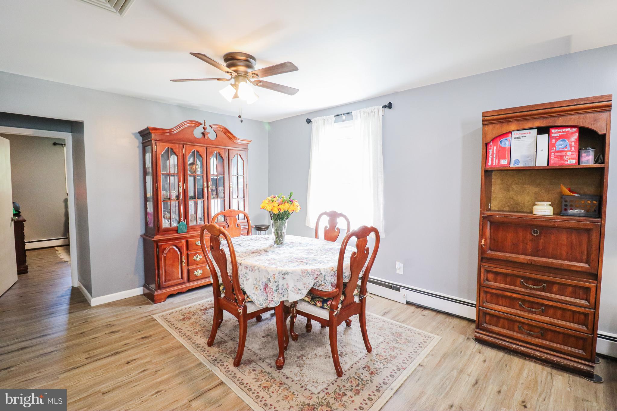 156 South Ritters Lane Owings Mills, MD 21117 - Photo 8 of 42 a view of a dining room with furniture and wooden floor