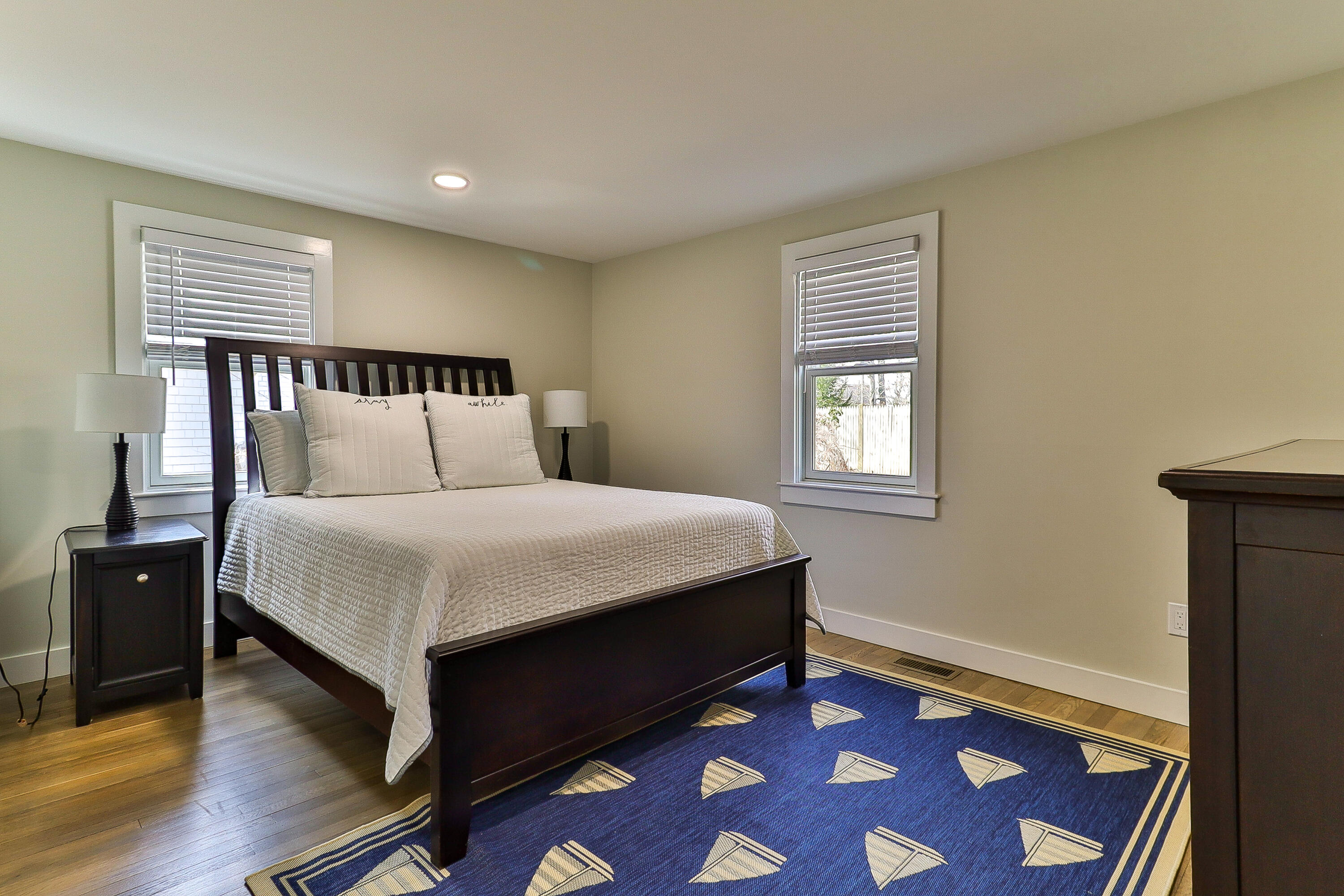 49 Huckins Neck Road Centerville, MA 02632 - Photo 11 of 23 a bed sitting in a bedroom next to a window