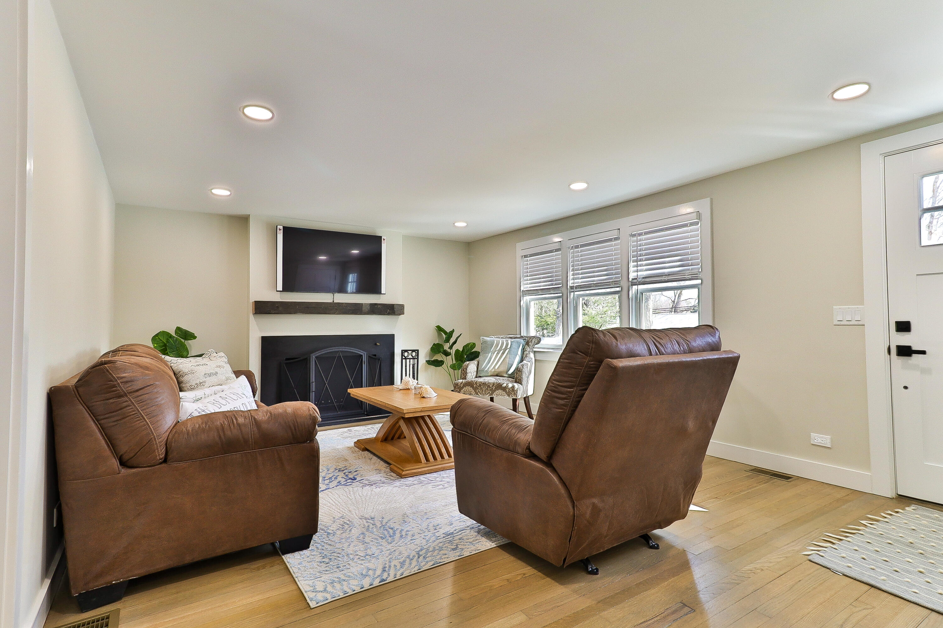 49 Huckins Neck Road Centerville, MA 02632 - Photo 3 of 23 a living room with furniture and a fireplace