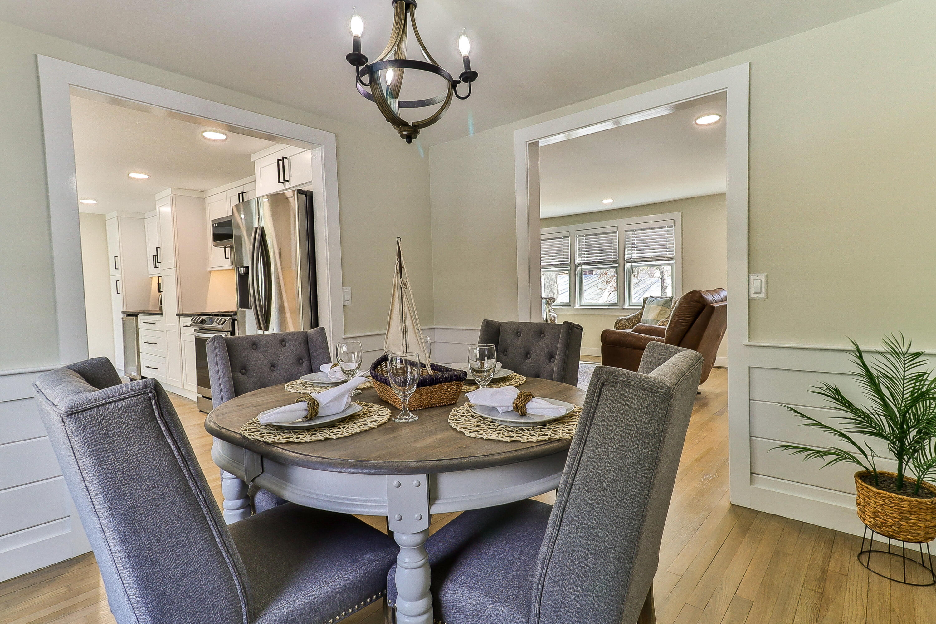 49 Huckins Neck Road Centerville, MA 02632 - Photo 9 of 23 a view of a dining room with furniture window and wooden floor