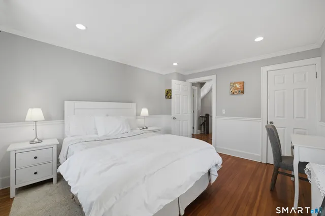 a large white bed in a white room