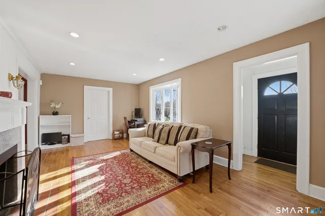 a living room with furniture and a rug