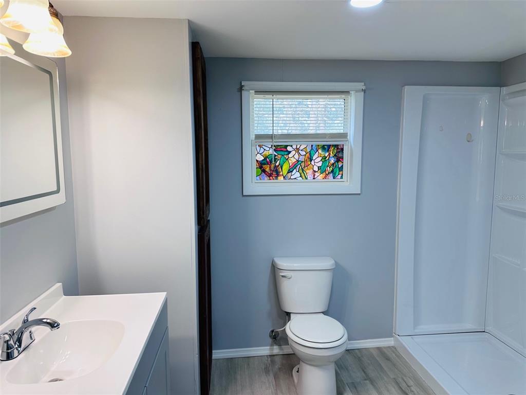 13750 Northwest 88th Terrace Chiefland, FL 32626 - Photo 15 of 33 a white toilet sitting next to a bathroom sink