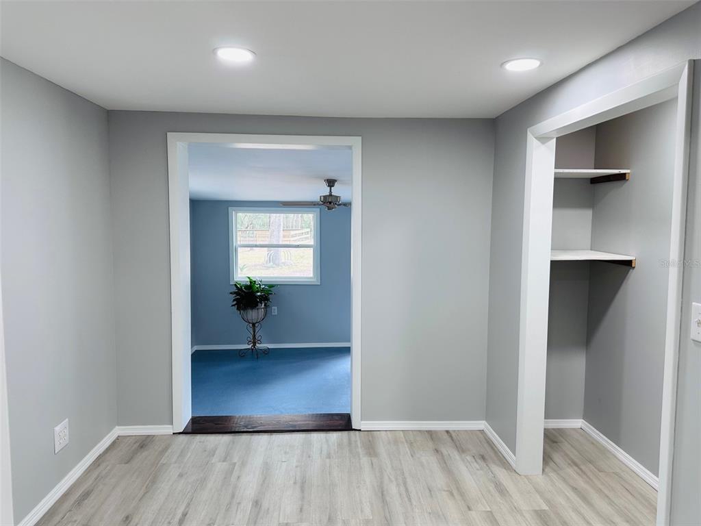 13750 Northwest 88th Terrace Chiefland, FL 32626 - Photo 17 of 33 wooden floor in a hall with a window